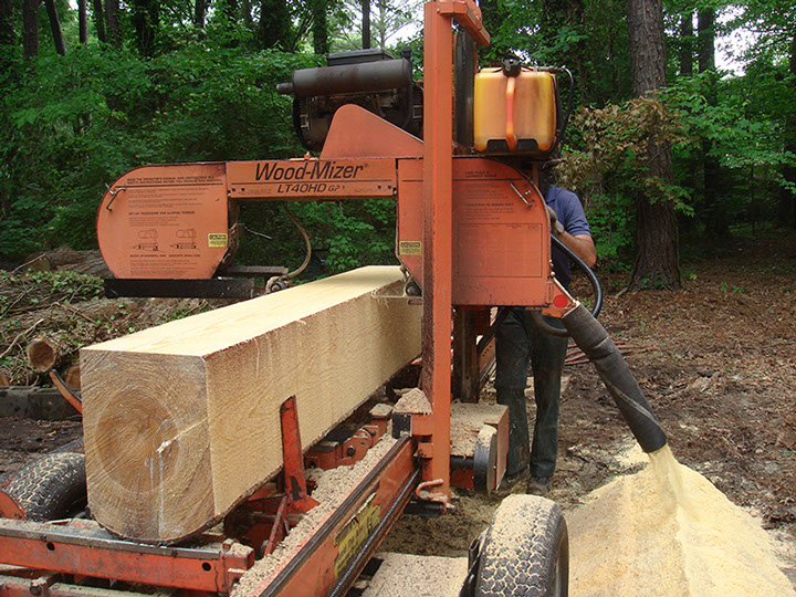 Paul Garrity Sawyer reducing home grown pine to lumber on site.