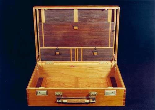 Interior view of custom rosewood attache case showing cigar and dictaphone compartments.