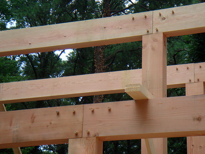 Solid Fir Beams with 1" Oak pins securing tenons and splines.