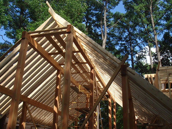 View of Post & Beam Construction merged with standard rafter roof in hybrid design.